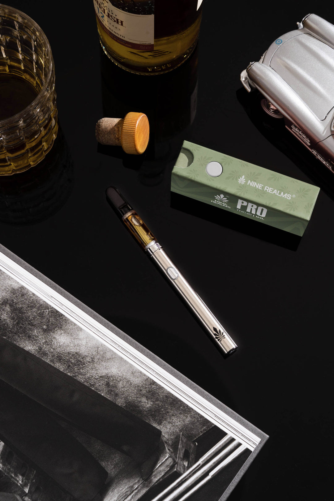 Nine Realms PRO THCJD Cartridge laying on the table