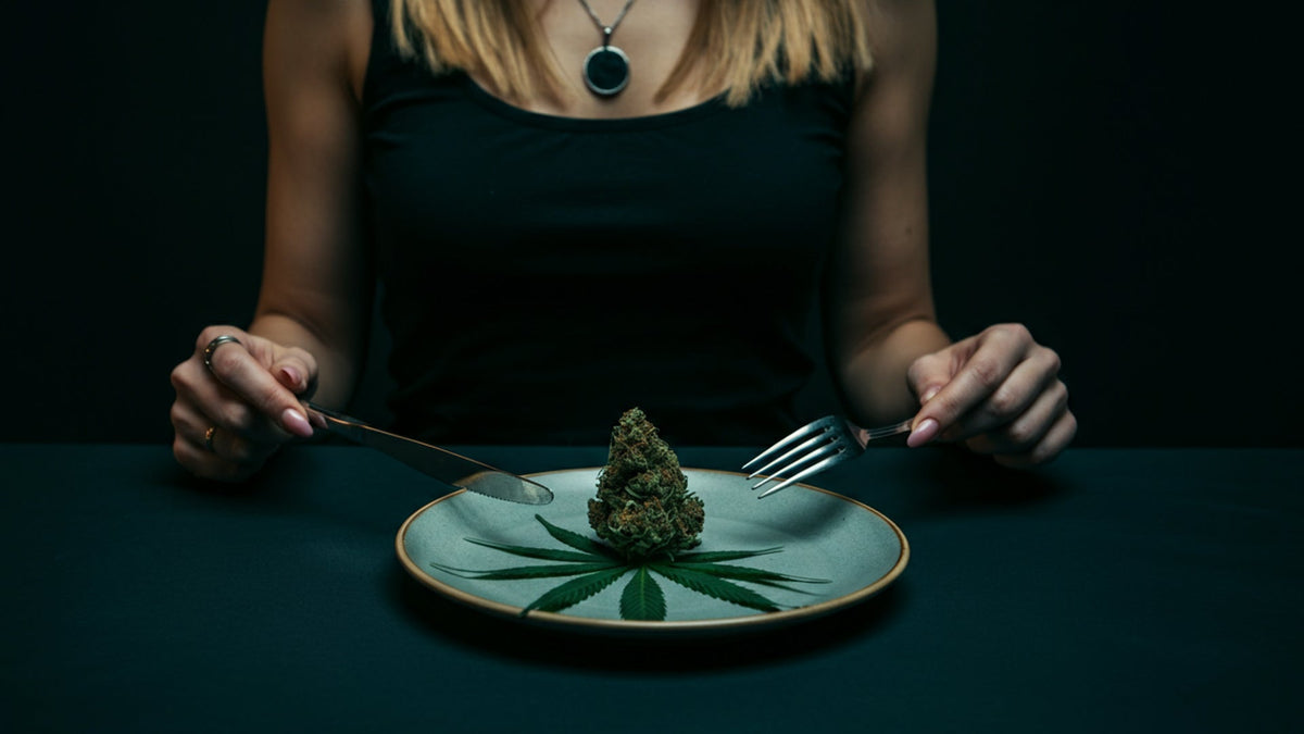 woman having a nine realms cannabis flower on a plate