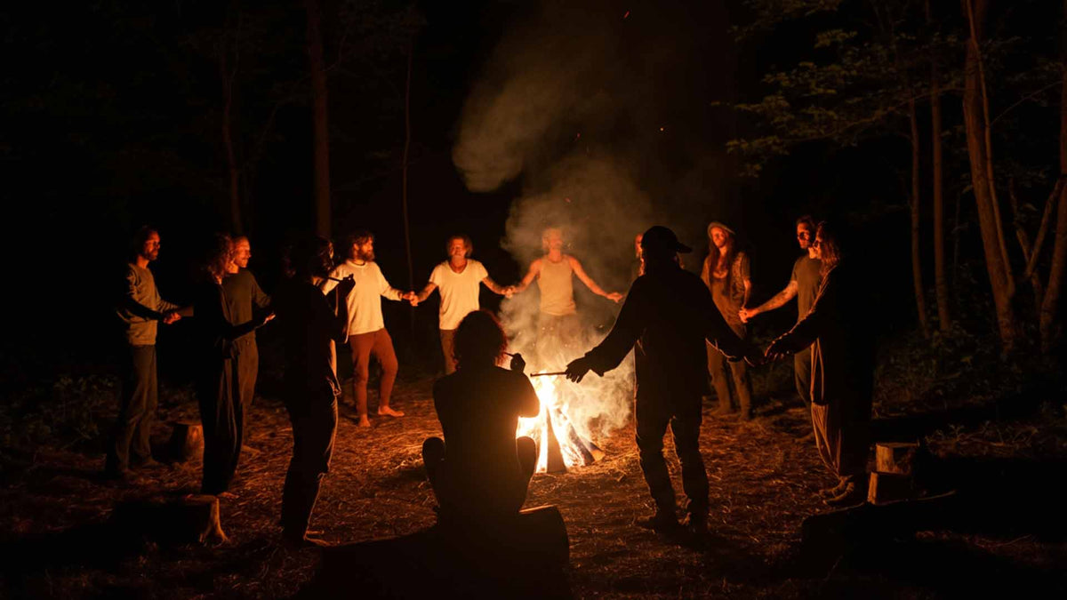 Nine Realms employees performing a cannabis ritual in the dark