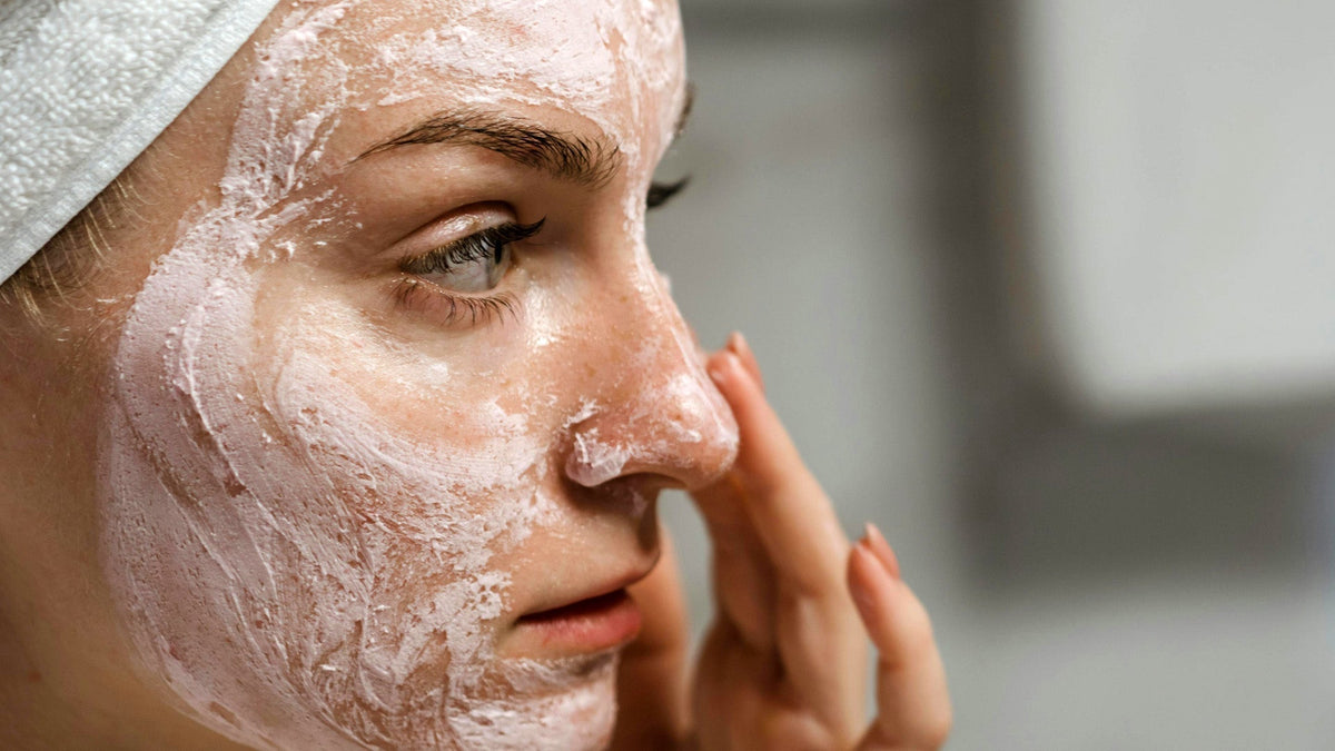 Nine Realms Customer Woman Using CBD Cream on her face