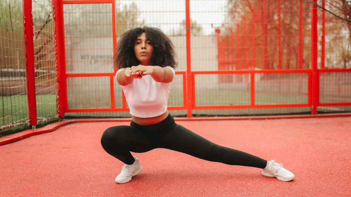 Nine Realms customer stretching in the park