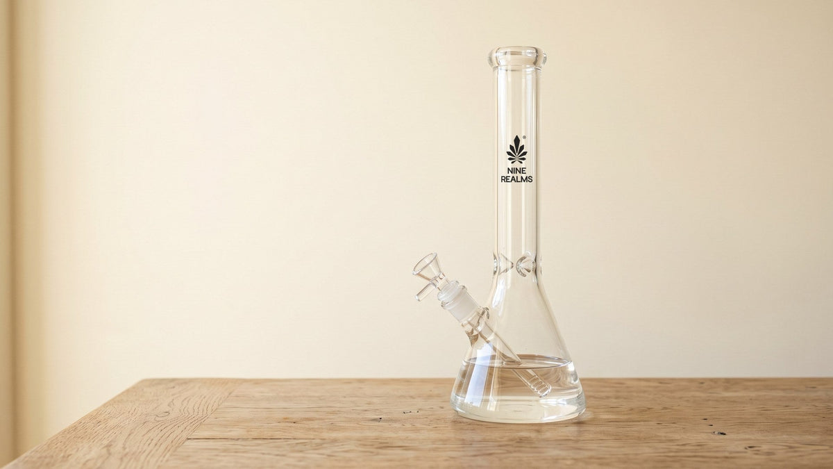 Nine Realms glass bong on a wooden table in beige living room