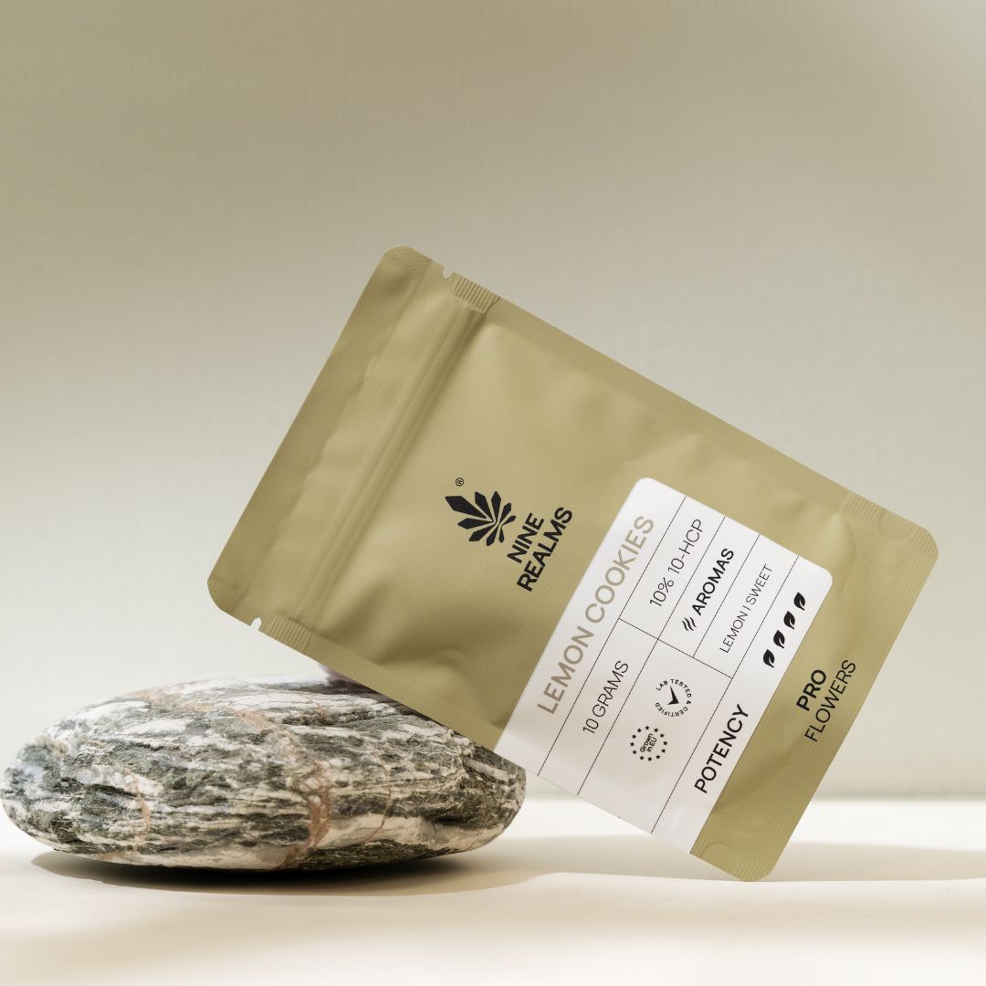 Nine Realms THCP Flower package on a rock