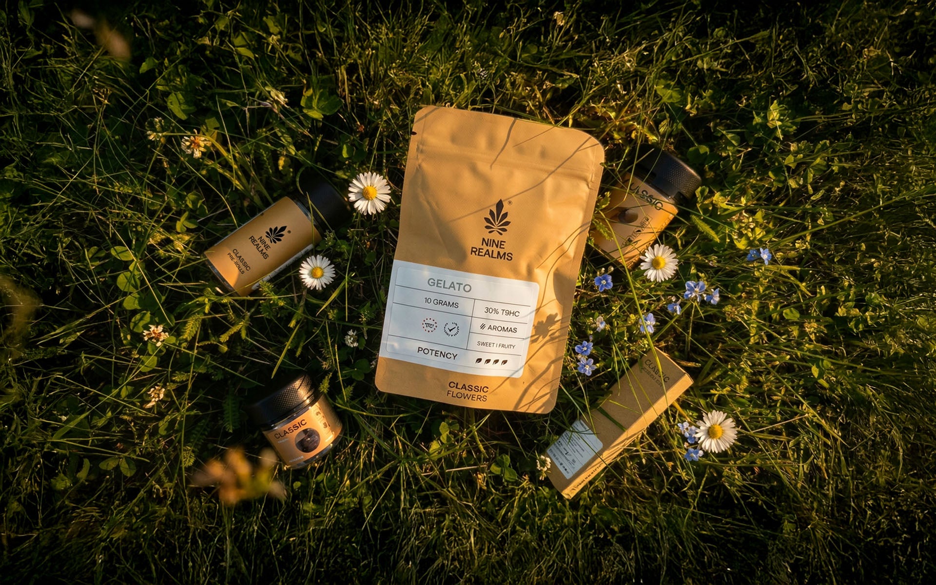 Nine Realms T9HC cannabis products displayed on grass
