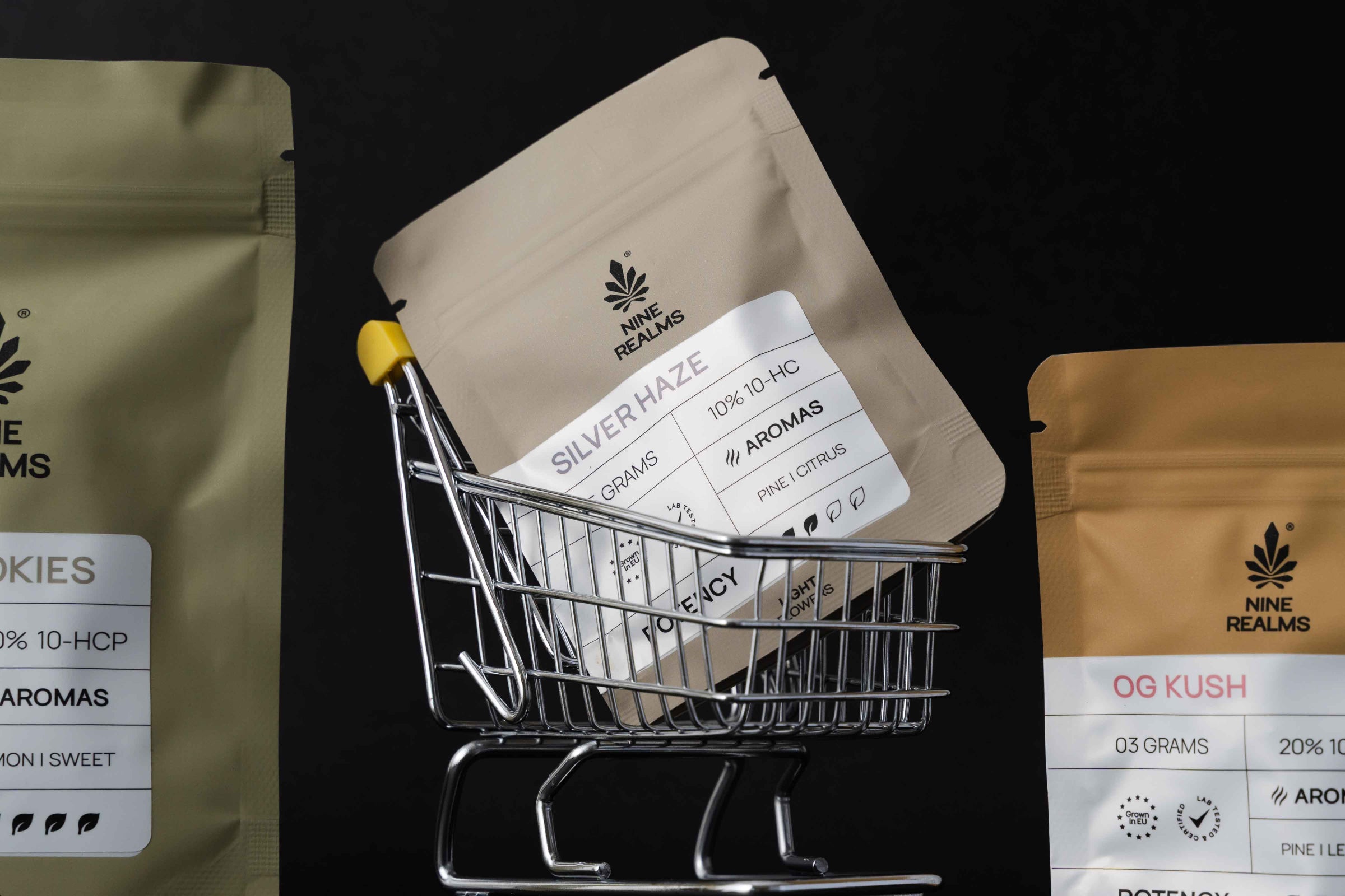 Nine realms cannabis flower in a miniature black friday shopping cart