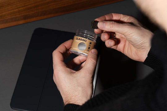 Nine Realms T9HC Dry Sift Hash in the office with an iPad next to it