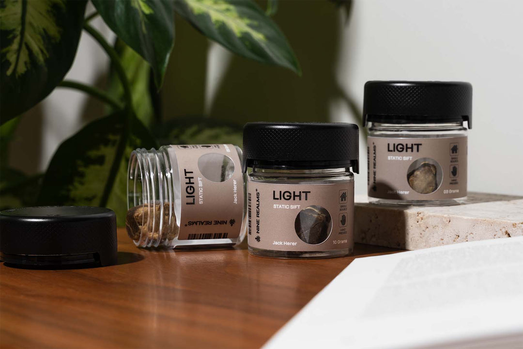 Nine Realms T9HC Static Sift Hash packages on a wooden table