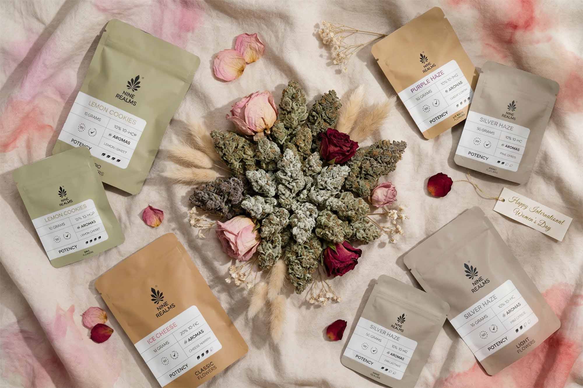 Nine Realms cannabis flowers ona tie dyed fabric with flower buds in the middle